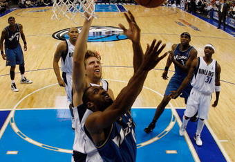 DALLAS - OCTOBER 27:  Guard Gilbert Arenas #0 of the Washington Wizards takes a shot against Dirk Nowitzki #41 of the Dallas Mavericks during the season opener on October 27, 2009 at American Airlines Center in Dallas, Texas.  NOTE TO USER: User expressly acknowledges and agrees that, by downloading and/or using this Photograph, user is consenting to the terms and conditions of the Getty Images License Agreement.  (Photo by Ronald Martinez/Getty Images)