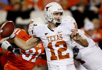 STILLWATER, OK - OCTOBER 31:  Quarterback Colt McCoy #12 of the Texas Longhorns goes back for a pass in the first quarter against the Oklahoma State Cowboys at Boone Pickens Stadium on October 31, 2009 in Stillwater, Oklahoma.  (Photo by Ronald Martinez/Getty Images)
