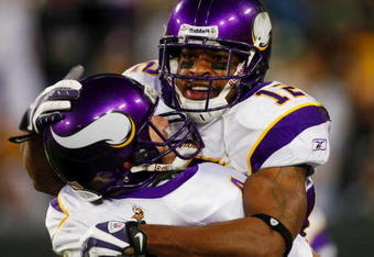 GREEN BAY, WI - NOVEMBER 01: Quarterback Brett Favre #4 of the Minnesota Vikings celebrates with teammate Percy Harvin #12 after a 51 yard touchdown pass during the third quarter of the game against the Green Bay Packers at Lambeau Field on November 1, 2009 in Green Bay, Wisconsin. (Photo by Scott Boehm/Getty Images)