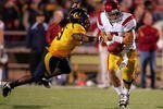 BERKELEY, CA - OCTOBER 03:  Matt Barkley #7 of the USC Trojans is pressured by Eddie Young #9 of the California Golden Bears at California Memorial Stadium on October 3, 2009 in Berkeley, California.  (Photo by Ezra Shaw/Getty Images)