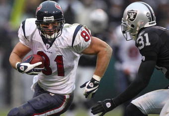 OAKLAND, CA - DECEMBER 21: Owen Daniels #81 of the Houston Texans runs after a catch against Hiram Eugene #31 of the Oakland Raiders during an NFL game on December 21, 2008 at the Oakland-Alameda County Coliseum in Oakland, California.  (Photo by Jed Jacobsohn/Getty Images)