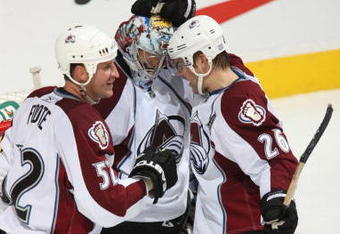 CALGARY, CANADA - OCTOBER 28:  Craig Anderson #41 of the Colorado Avalanche is congratulated by teammates Adam Foote #52 and Paul Stastny #26 following their team's 10th win of the season against the Calgary Flames on October 28, 2009 at the Pengrowth Saddledome in Calgary, Alberta, Canada. (Photo by Dale MacMillan/Getty Images)