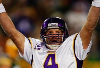 GREEN BAY, WI - NOVEMBER 01: Quarterback Brett Favre #4 of the Minnesota Vikings celebrates a touchdown by teammate Percy Harvin #12 after a 51 yard touchdown pass during the third quarter of the game against the Green Bay Packers at Lambeau Field on November 1, 2009 in Green Bay, Wisconsin. (Photo by Scott Boehm/Getty Images)