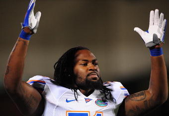 STARKVILLE, MS - OCTOBER 24:  Linebacker Brandon Spikes # 51 of the Florida Gators signals a touchdown against the Mississippi Bulldogs, at Davis Wade Stadium on  October 24, 2009 in Starkville, Mississippi  (Photo by Rick Dole/Getty Images)