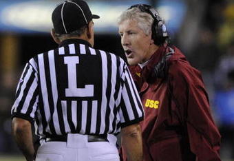 EUGENE, OR - OCTOBER 31: Head coach Pete Carroll of the USC Trojans speaks to an official in the third quarter of the game against the Oregon Ducks at Autzen Stadium on October 31, 2009 in Eugene, Oregon. The Ducks upset the Trojans 47-20. (Photo by Steve Dykes/Getty Images)