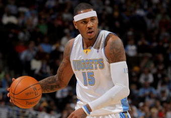 DENVER - OCTOBER 28:  Carmelo Anthony #15 of the Denver Nuggets dribbles the ball upcourt against the Utah Jazz during NBA action at Pepsi Center on October 28, 2009 in Denver, Colorado. The Nuggets defeated the Jazz 114-105.  (Photo by Doug Pensinger/Getty Images)