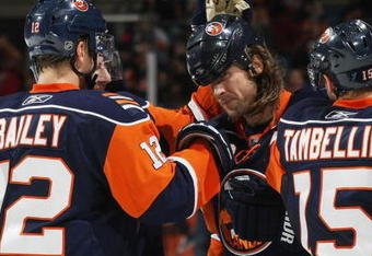 UNIONDALE, NY - NOVEMBER 02: Josh Bailey #12 (L)  and Steve Tambellini #15 (R) of the New York Islanders congratulate Brendan Witt #32 (C) on his second of two goals in the second period against the Edmonton Oilers at the Nassau Coliseum on November 2, 2009 in Uniondale, New York. (Photo by Bruce Bennett/Getty Images)