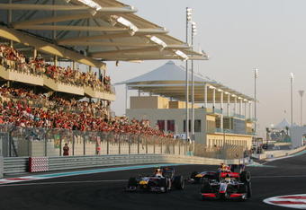 ABU DHABI, UNITED ARAB EMIRATES - NOVEMBER 01:  Lewis Hamilton (R) of Great Britain and McLaren Mercedes leads from Sebastian Vettel (L) of Germany and Red Bull Racing as they drive during the Abu Dhabi Formula One Grand Prix at the Yas Marina Circuit on November 1, 2009 in Abu Dhabi, United Arab Emirates.  (Photo by Ker Robertson/Getty Images)