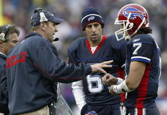 ORCHARD PARK, NY - NOVEMBER 27: Mike Mullarkey, head coach of the Buffalo Bills talks to JP Losman #7 as Shane Matthews #6 listens during a timeout against the Carolina Panthers  on November 27, 2005 at Ralph Wilson Stadium in Orchard Park, New York. (Photo by Rick Stewart/Getty Images)
