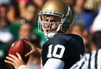 SOUTH BEND, IN - SEPTEMBER 19: Dayne Crist #10 of the Notre Dame Fighting Irish looks for a receiver against the Michigan State Spartans on September 19, 2009 at Notre Dame Stadium in South Bend, Indiana. Notre Dame defeated Michigan State 33-30. (Photo by Jonathan Daniel/Getty Images)