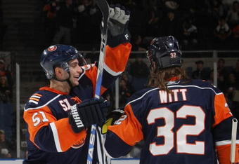 UNIONDALE, NY - NOVEMBER 02: Frans Nielsen #51 (L)  of the New York Islanders congratulates Brendan Witt #32 (R) on his first of two goals in the second period against the Edmonton Oilers at the Nassau Coliseum on November 2, 2009 in Uniondale, New York. (Photo by Bruce Bennett/Getty Images)