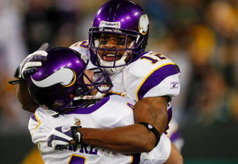 GREEN BAY, WI - NOVEMBER 01: Quarterback Brett Favre #4 of the Minnesota Vikings celebrates with teammate Percy Harvin #12 after a 51 yard touchdown pass during the third quarter of the game against the Green Bay Packers at Lambeau Field on November 1, 2009 in Green Bay, Wisconsin. (Photo by Scott Boehm/Getty Images)