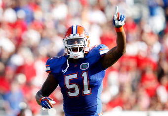 JACKSONVILLE, FL - OCTOBER 31:  Brandon Spikes #51 of the Florida Gators calls the defense against the Georgia Bulldogs at Jacksonville Municipal Stadium on October 31, 2009 in Jacksonville, Florida.  (Photo by Kevin C. Cox/Getty Images)