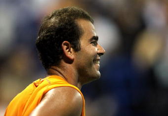 LOS ANGELES, CA - JULY 27:  Tournament honoree Pete Sampras smiles while taking on Marat Safin in the Millennium Challenge during the LA Tennis Open Day 1 at Los Angeles Tennis Center - UCLA on July 27, 2009 in Los Angeles, California.  Safin defeated Sampras 6-4, 3-6, 1-0.  (Photo by Stephen Dunn/Getty Images)
