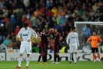 MADRID, SPAIN - OCTOBER 21:  Kaka (L) of Real Madrid stands dejected after conceding a goal as AC Milan players celebrate in the background during the Champions League group C match between Real Madrid and AC Milan at the Estadio Santiago Bernabeu on October 21, 2009 in Madrid, Spain. AC Milan won the match 3-2.  (Photo by Jasper Juinen/Getty Images)
