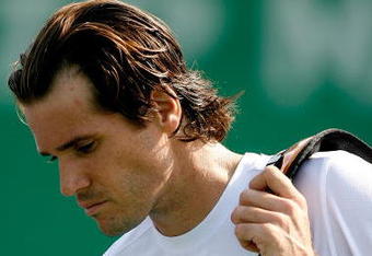 SHANGHAI, CHINA - OCTOBER 14:  Tommy Haas of Germany leaves the court after retiring from his match against Rainer Schuettler of Germany during the 2009 Shanghai ATP Masters 1000 at Qi Zhong Tennis Centre on October 14, 2009 in  (Photo by Matthew Stockman/Getty Images)