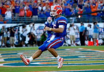 JACKSONVILLE, FL - OCTOBER 31:  Quarterback Tim Tebow #15 of the Florida Gators rushes in for a touchdown against the Georgia Bulldogs at Jacksonville Municipal Stadium on October 31, 2009 in Jacksonville, Florida.  (Photo by Kevin C. Cox/Getty Images)