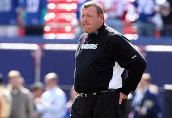 EAST RUTHERFORD, NJ - OCTOBER 11:  Head coach Tom Cable of the Oakland Raiders looks on before playing the New York Giants on October 11, 2009 at Giants Stadium in East Rutherford, New Jersey.  (Photo by Jim McIsaac/Getty Images)