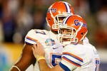 MIAMI - JANUARY 08:  Tim Tebow #15 (R) and Carl Johnson #57 of the Florida Gators celebrate after Tebow threw a 20-yard touchdown pass to Louis Murphy #9 in the second quarter against the Oklahoma Sooners during the FedEx BCS National Championship game at Dolphin Stadium on January 8, 2009 in Miami, Florida.  (Photo by Marc Serota/Getty Images)