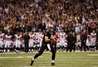 NEW ORLEANS - NOVEMBER 2: Quarterback Drew Brees #12 of the New Orleans Saints celebrates a complete pass against the Atlanta Falcons during the fourth quarter of the game at the Louisiana Superdome on November 2, 2009 in New Orleans, Louisiana. (Photo by Chris Graythen/Getty Images)