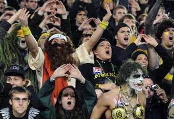EUGENE, OR - OCTOBER 31:  Oregon Ducks fans make some noise on a Halloween night game against the USC Trojans at Autzen Stadium on October 31, 2009 in Eugene, Oregon. The crowd noise at Autzen Stadium is said to be one of the loudest in the nation and reportedly was a factor in Oregon defeating USC 47-20.  (Photo by Steve Dykes/Getty Images)