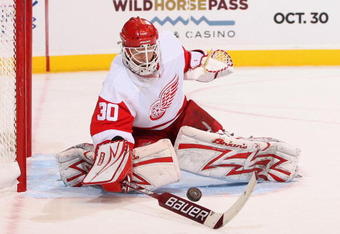 GLENDALE, AZ - OCTOBER 22:  Goaltender Chris Osgood #30 of the Detroit Red Wings in action during the NHL game against the Phoenix Coyotes at Jobing.com Arena on October 22, 2009 in Glendale, Arizona. The Coyotes defeated the Red Wings 3-2 in overtime.  (Photo by Christian Petersen/Getty Images)