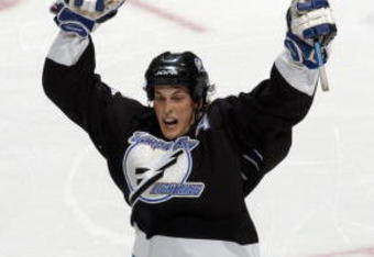 WASHINGTON - APRIL 15:  Vincent Lecavalier #4 of the Tampa Bay Lightning celebrates with Dan Boyle #22 after Lecavalier scored the game winning goal in overtime against the Washington Capitals in game three of the first round of the 2003 Eastern Conference Stanley Cup playoffs at the MCI Center on April 15, 2003 in Washington, DC. The Lightning defeated the Capitals 4-3 in overtime. (Photo by Doug Pensinger/Getty Images/NHLI) 