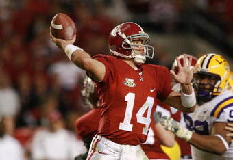 TUSCALOOSA, AL - NOVEMBER 03:  John Parker Wilson #14 of the Alabama Crimson Tide throws a touchdown pass against the LSU Tigers at Bryant-Denny Stadium on November 3, 2007 in Tuscaloosa, Alabama. LSU defeated Alabama 41-34.  (Photo by Doug Benc/Getty Images)