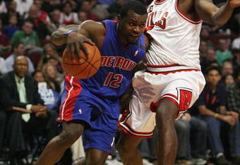CHICAGO - MARCH 24: Will Bynum #12 of the Detroit Pistons drives around Tim Thomas #2 of the Chicago Bulls on March 24, 2009 at the United Center in Chicago, Illinois. The Bulls defeated the Pistons 99-91. NOTE TO USER: User expressly acknowledges and agreees that, by downloading and/or using this Photograph, User is consenting to the terms and conditions of the Getty Images License Agreement. (Photo by Jonathan Daniel/Getty Images)