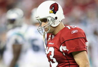 GLENDALE, AZ - NOVEMBER 01:  Quarterback Kurt Warner #13 of the Arizona Cardinals walks off the field after fumbling the ball during the fourth quarter of the NFL game against the Carolina Panthers at the Universtity of Phoenix Stadium on November 1, 2009 in Glendale, Arizona. The Panthers defeated the Cardinals 34-21.  (Photo by Christian Petersen/Getty Images)