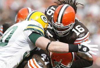 CLEVELAND, OH - OCTOBER 25:  Joshua Cribbs #16 of the Cleveland Browns is hit by A.J. Hawk #50 and Clay Matthews #52 of the Green Bay Packers at Cleveland Browns at Cleveland Browns Stadium on October 25, 2009 in Cleveland, Ohio.  (Photo by Matt Sullivan/Getty Images)