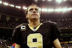 NEW ORLEANS - NOVEMBER 2:  Quarterback Drew Brees #9 of the New Orleans Saints leaves the field after leading his team to a 35-27 victory over the Atlanta Falcons in the game at the Louisiana Superdome on November 2, 2009 in New Orleans, Louisiana. (Photo by Chris Graythen/Getty Images)