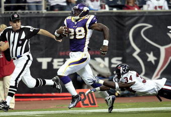 HOUSTON - AUGUST 31:  Running back Adrian Peterson #28 scores on a 75 yard run as strong safety Dominique Barber #34 of the Houston Texans makes a diving attempt to make the tackle at Reliant Stadium on August 31, 2009 in Houston, Texas.  (Photo by Bob Levey/Getty Images)