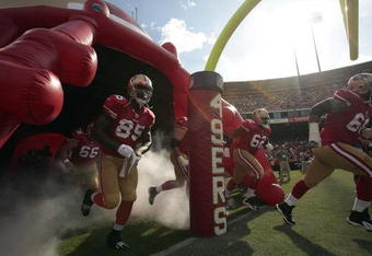 SAN FRANCISCO - AUGUST 22:  San Francisco 49ers tight end Vernon Davis #85, San Francisco 49ers center Eric Heitmann #66, San Francisco 49ers guard Chilo Rachal #62 and San Francisco 49ers guard Adam Snyder #68 run out onto the field in to start the game as the San Francisco 49ers host the Oakland Raiders at Candlestick Park August 22, 2009 in San Francisco, California.  (Photo by David Paul Morris/Getty Images)
