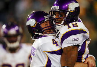GREEN BAY, WI - NOVEMBER 01: Quarterback Brett Favre #4 of the Minnesota Vikings celebrates with teammate Percy Harvin #12 after a 51 yard touchdown pass during the third quarter of the game against the Green Bay Packers at Lambeau Field on November 1, 2009 in Green Bay, Wisconsin. (Photo by Scott Boehm/Getty Images)