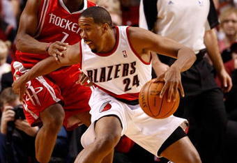 PORTLAND, OR - OCTOBER 27:  Kyle Lowry #7 of the Houston Rockets guards Andre Miller #24 of the Portland Trail Blazers during the season opener on October 27, 2009 at the Rose Garden in Portland, Oregon. NOTE TO USER: User expressly acknowledges and agrees that, by downloading and or using this Photograph, user is consenting to the terms and conditions of the Getty Images License Agreement.  (Photo by Jonathan Ferrey/Getty Images)