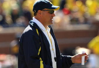 ANN ARBOR, MI - SEPTEMBER 19:  Head coach Rich Rodriguez of the Michigan Wolverines watches warmups before the game with the Eastern Michigan Eagles at Michigan Stadium on September 19, 2009 in Ann Arbor, Michigan.  Michigan won 45-17.  (Photo by Stephen Dunn/Getty Images)