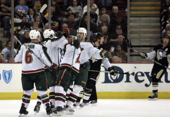 PITTSBURGH, PA - OCTOBER 31:  Eric Belanger #25 of the Minnesota Wild celebrates his goal with teammates in the first period against the Pittsburgh Penguins at Mellon Arena on October 31, 2009 in Pittsburgh, Pennsylvania.  (Photo by Justin K. Aller/Getty Images)