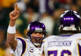 GREEN BAY, WI - NOVEMBER 01: Quarterback Brett Favre #4 of the Minnesota Vikings celebrates a touchdown by teammate Percy Harvin #12 after a 51 yard touchdown pass during the third quarter of the game against the Green Bay Packers at Lambeau Field on November 1, 2009 in Green Bay, Wisconsin. (Photo by Scott Boehm/Getty Images)