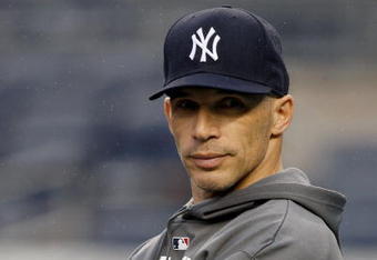 NEW YORK - OCTOBER 27:  Manager Joe Girardi of the New York Yankees watches his team during World Series workouts on October 27, 2009 at Yankee Stadium in the Bronx borough of New York City.  (Photo by Jared Wickerham/Getty Images)