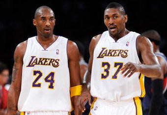 LOS ANGELES, CA - NOVEMBER 01:  Kobe Bryant #24 and Ron Artest of the Los Angeles Lakers talk against the Atlanta Hawks during the second quarter of the NBA basketball game at Staples Center on November 1, 2009 in Los Angeles, California. Bryant scored 41 points and the Lakers went on to win 118-110. NOTE TO USER: User expressly acknowledges and agrees that, by downloading and/or using this Photograph, user is consenting to the terms and conditions of the Getty Images License Agreement.  (Photo by Kevork Djansezian/Getty Images)