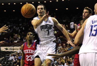 ORLANDO, FL - OCTOBER 28:  J.J. Redick #7 of the Orlando Magic passes the ball during the game against the Philadelphia 76ers on October 28, 2009 at Amway Arena in Orlando, Florida.  NOTE TO USER: User expressly acknowledges and agrees that, by downloading and/or using this Photograph, user is consenting to the terms and conditions of the Getty Images License Agreement.  (Photo by Sam Greenwood/Getty Images)