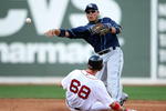 BOSTON - SEPTEMBER 13:  Akinori Iwamura #1 of the Tampa Bay Rays sends the ball to first as Josh Reddick #68 of the Boston Red Sox is out at second on September 13, 2009 at Fenway Park in Boston, Massachusetts.  (Photo by Elsa/Getty Images)