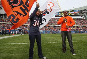 CHICAGO - NOVEMBER 01: Brittany and Jarrett Payton, daughter and son of Chicago Bears player Walter Payton, participate in pre-game ceremonies on the 10th anniversary of their father's death before a game between the Bears and the Cleveland Browns at Soldier Field on November 1, 2009 in Chicago, Illinois. The Bears defeated the Browns 30-6. (Photo by Jonathan Daniel/Getty Images)