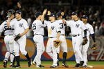 NEW YORK - OCTOBER 29:  Johnny Damon #18, Brett Gardner #11 and Derek Jeter #2 of the New York Yankees celebrate after defeating the Philadelphia Phillies two win Game Two of the 2009 MLB World Series by a score of 3-1 at Yankee Stadium on October 29, 2009 in the Bronx borough of New York City.  (Photo by Jed Jacobsohn/Getty Images)