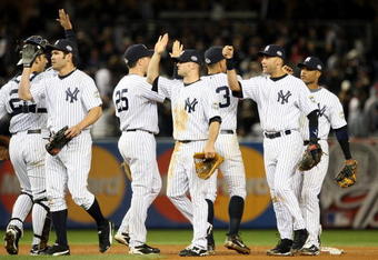 NEW YORK - OCTOBER 29:  Johnny Damon #18, Brett Gardner #11 and Derek Jeter #2 of the New York Yankees celebrate after defeating the Philadelphia Phillies two win Game Two of the 2009 MLB World Series by a score of 3-1 at Yankee Stadium on October 29, 2009 in the Bronx borough of New York City.  (Photo by Jed Jacobsohn/Getty Images)