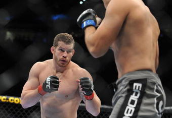 PORTLAND, OR - AUGUST 29:  UFC fighter Nate Marquardt (L) battles UFC fighter Demian Maia (R) during their Middleweight bout at UFC 102:  Couture vs. Nogueira at the Rose Garden Arena on August 29, 2009 in Portland, Oregon.  (Photo by Jon Kopaloff/Getty Images)