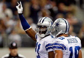 ARLINGTON, TX - NOVEMBER 01:  Wide receiver Roy Williams #11 celebrates a touchdown with Miles Austin #18 of the Dallas Cowboys at Cowboys Stadium on November 1, 2009 in Arlington, Texas.  (Photo by Ronald Martinez/Getty Images)