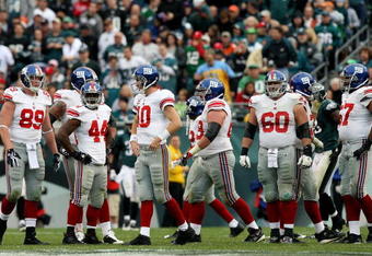 PHILADELPHIA - NOVEMBER 01: Eli Manning #10 of the New York Giants and his teammates look on after losing against the Philadelphia Eagles in the second half on November 1, 2009 at Lincoln Financial Field in Philadelphia, Pennsylvania. The Eagles defeated the Giants 40-17.  (Photo by Jim McIsaac/Getty Images)