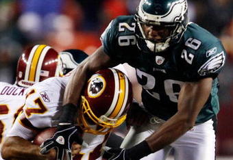 LANDOVER, MD - OCTOBER 26:  Quarterback Jason Campbell #17 of the Washington Redskins avoids a sack by Sean Jones #26 of the Philadelphia Eagles during fourth quarter action at FedEx Field October 26, 2009 in Landover, Maryland. The Eagles won the game 27-17.  (Photo by Win McNamee/Getty Images)